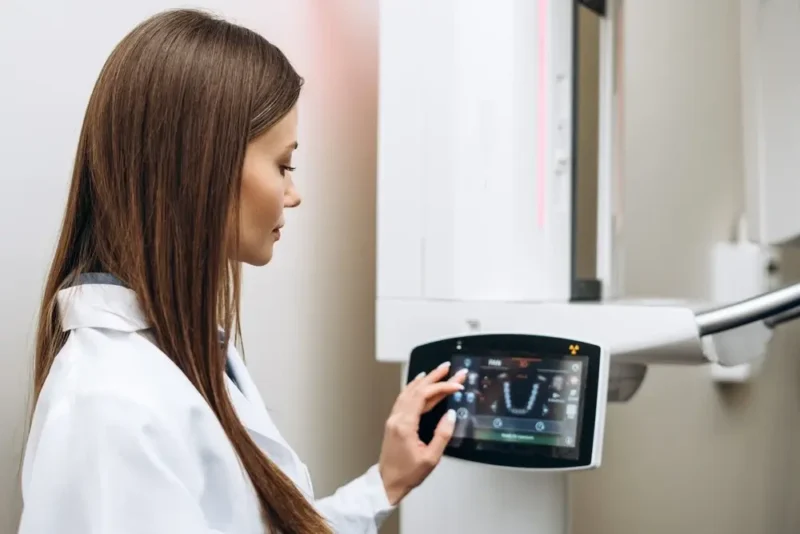 Dentist in Turkey operating a 3D CBCT scan machine