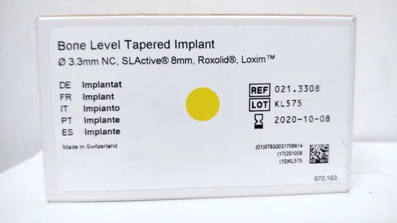 Close-up picture of a package showing the REF and LOT codes of dental implants in Turkey