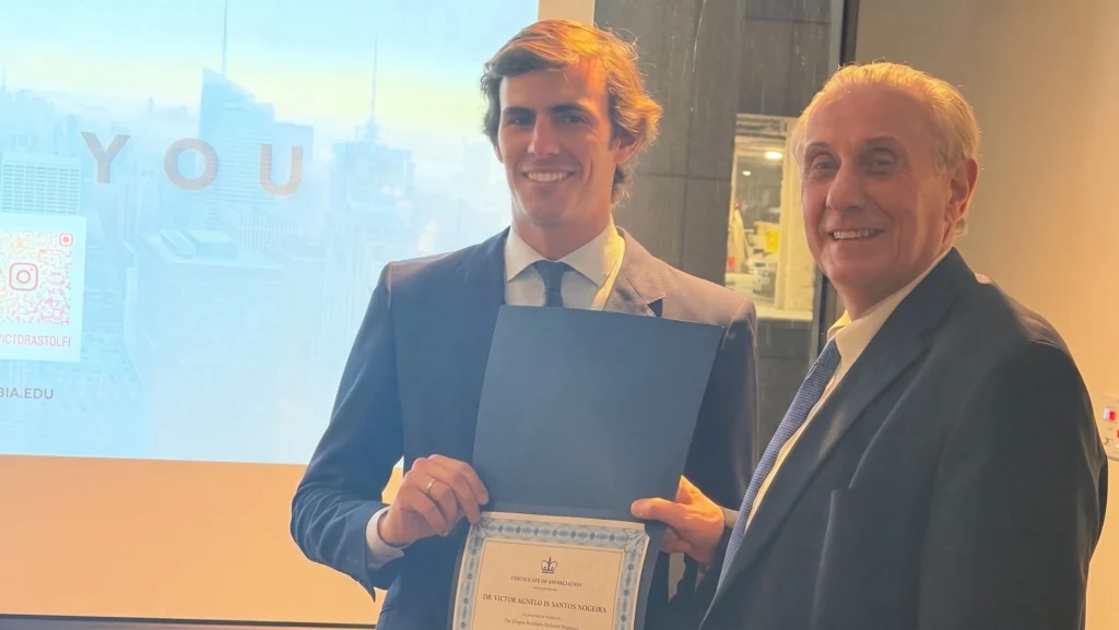 Dr Victor Astolfi receiving his Columbia University Diploma next to his professor